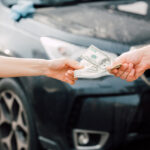 Handing Over Cash for Car Payment