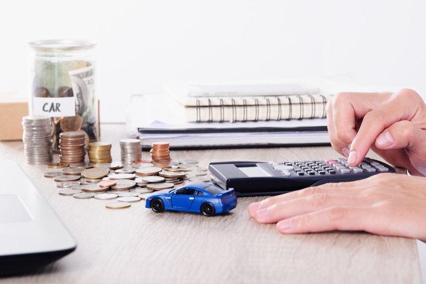 Reviewing Subaru financing options with a calculator