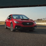 Red 2026 Subaru WRX tS on the road