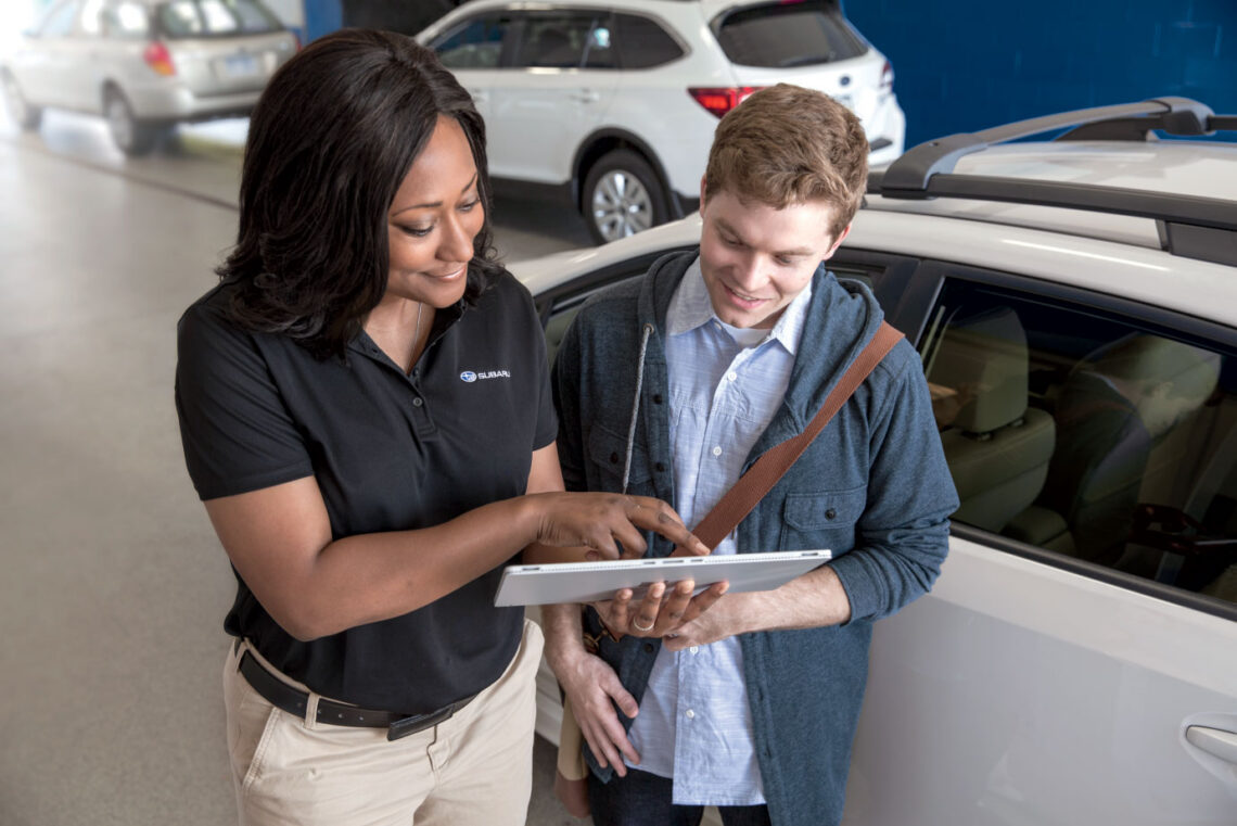 Subaru service rep discussing options with a customer