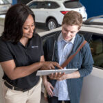 Subaru service rep discussing options with a customer