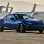 2027 Subaru BRZ driving outside with planes in the background