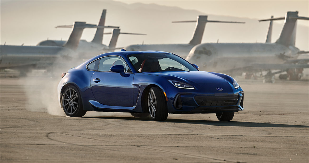 2027 Subaru BRZ driving outside with planes in the background