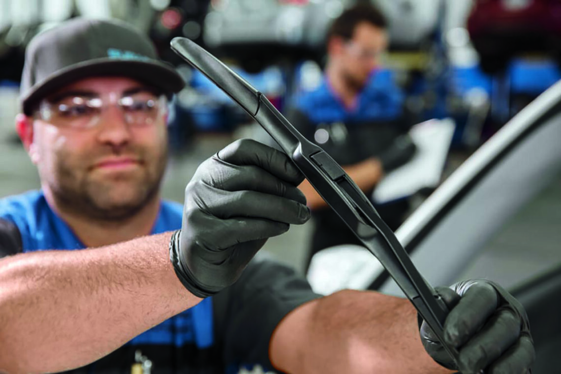 Subaru service tech checking wiper blades