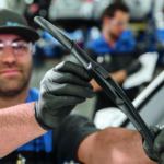Subaru service tech checking wiper blades